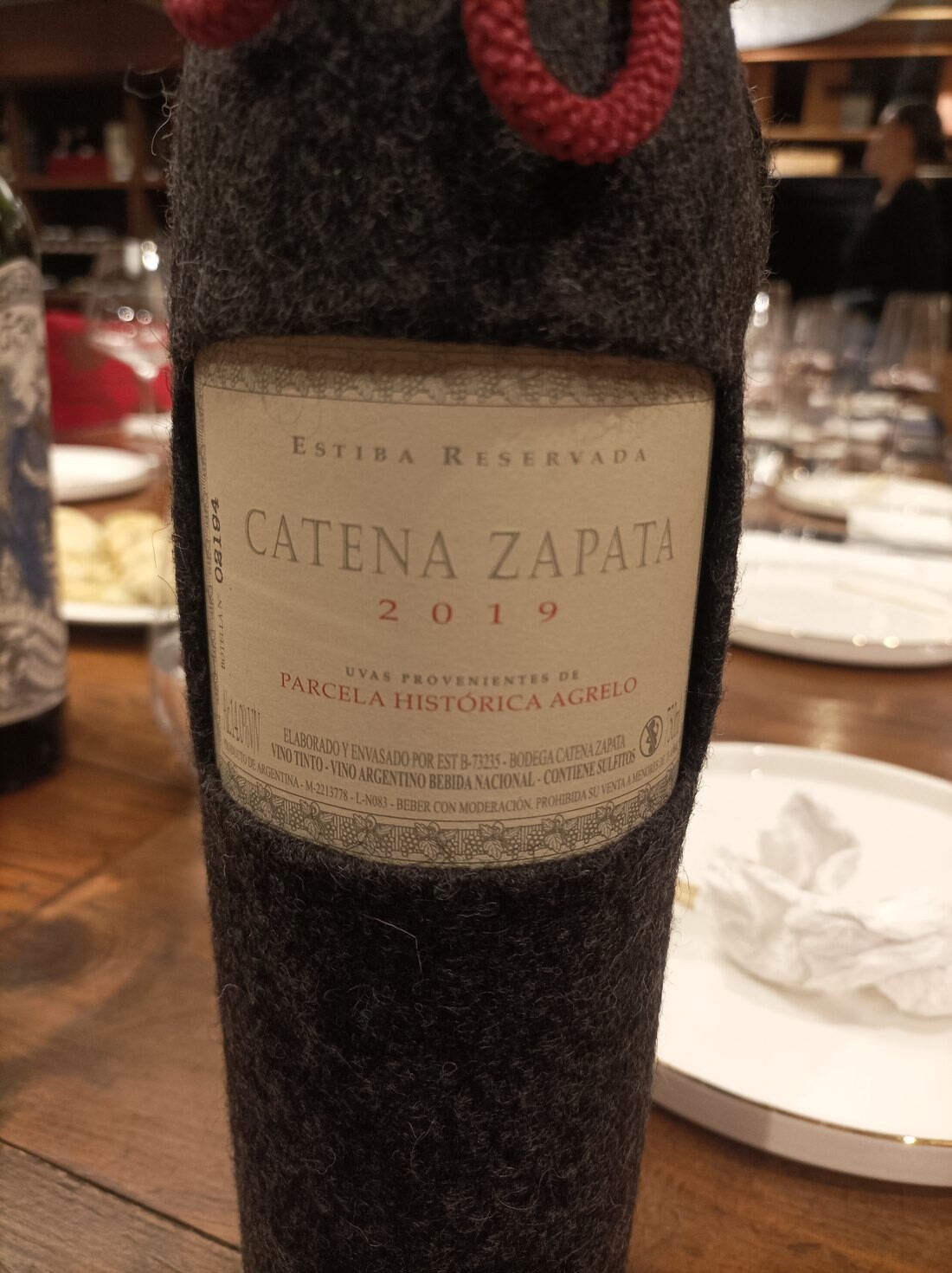 Catena Zapata Estiba Reservada 2019 bottle in its grey felt sleeve, Parcela Historica Agrelo