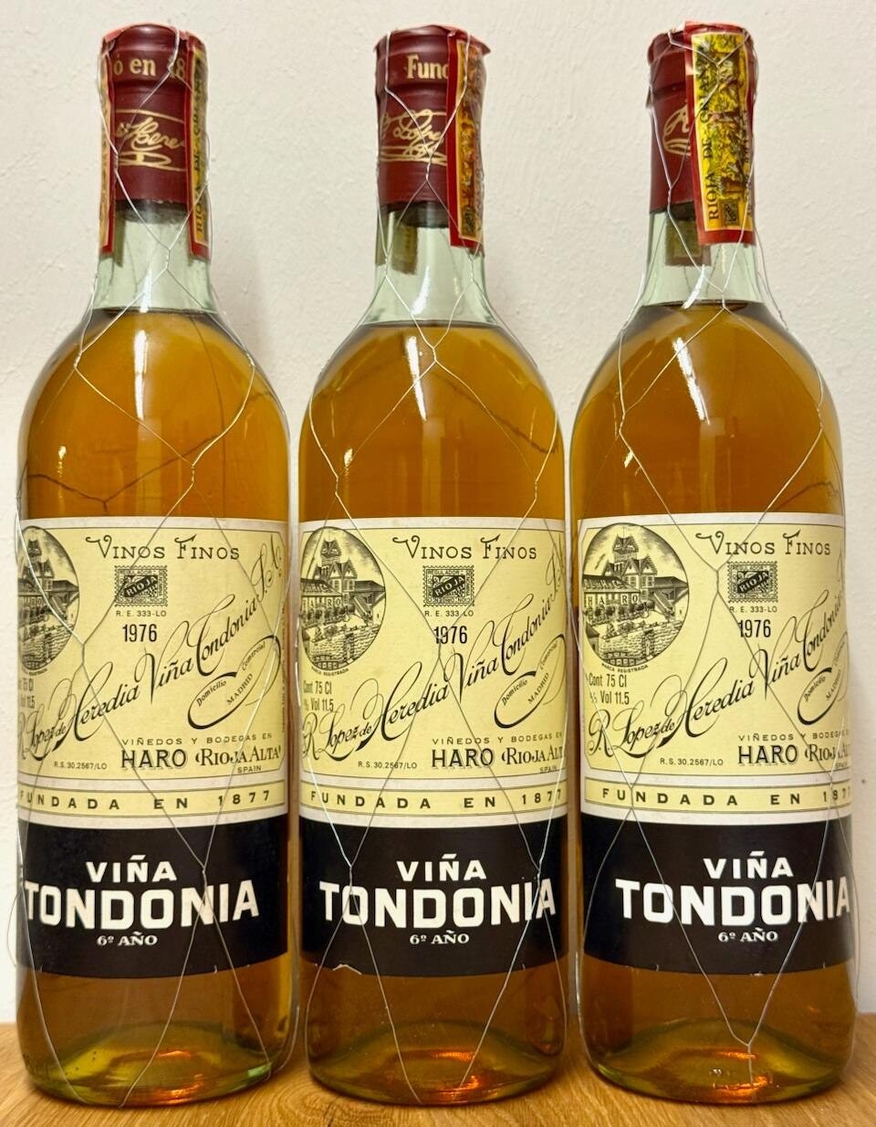 Three bottles of 1976 R. López de Heredia Viña Tondonia Blanco Reserva in their wire mesh